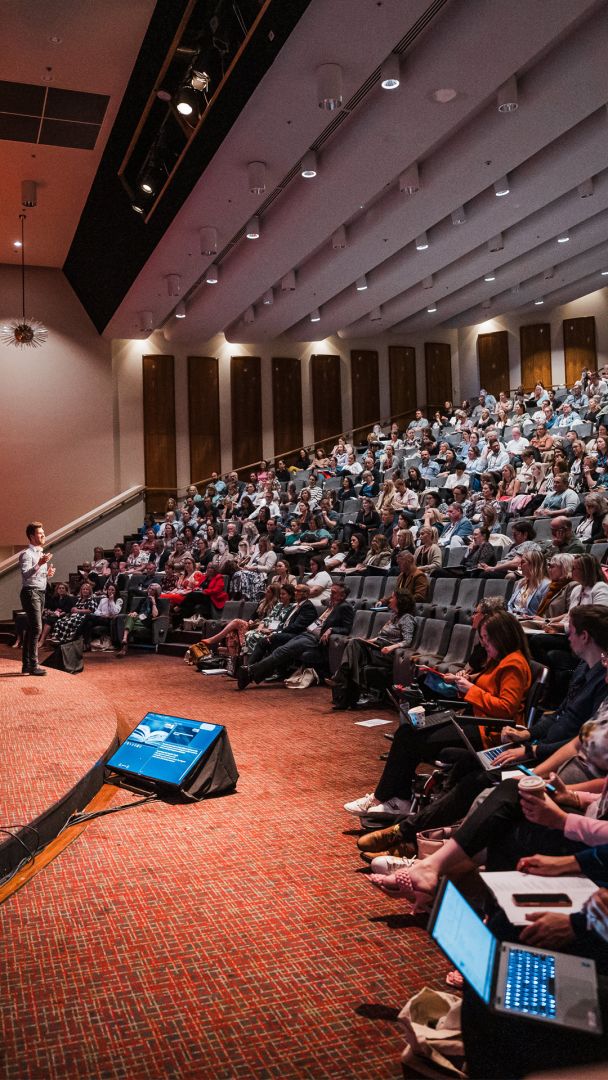 People listening to the conference